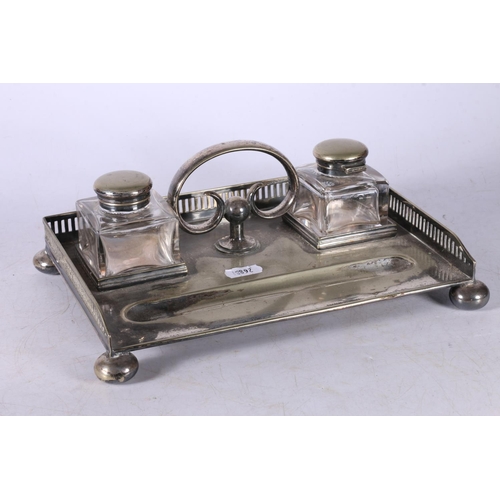 97 - EPNS inkstand with two glass inkwells, raised on bun feet, 10cm x 26cm x 18cm.