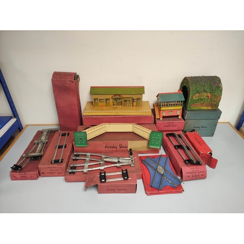 130 - Hornby. 0 gauge boxed tin plate track components to include Signal Cabin No 2, Railway Station No 3,... 