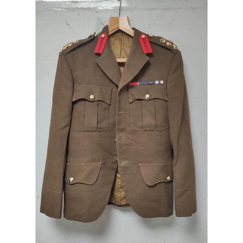 224 - Post war British Army tunic of the Highland Light Infantry belonging to Maj G.B Campbell bearing pap... 