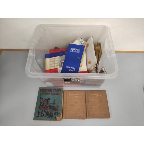 257 - Box containing an assortment of world stamp albums and guides. 