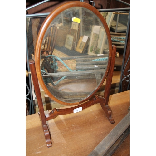 704 - Oval mahogany frame toilet mirror, 48cm.