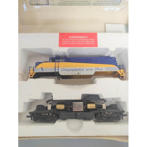 138 - Boxed HO gauge Proto Series 2000 BL2 8692 Western Maryland Locomotive plus a box of N gauge locomoti... 