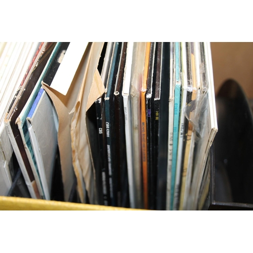 308 - Two boxes of mixed records to include Paul Simon, Fleetwood Mac, Queen, Elton John, etc (over 60) an... 