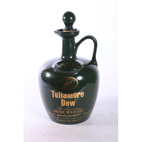 131B - Three Ballantine's whisky bottles, and a Tullamore Dew, all empty, largest, 24cm. 