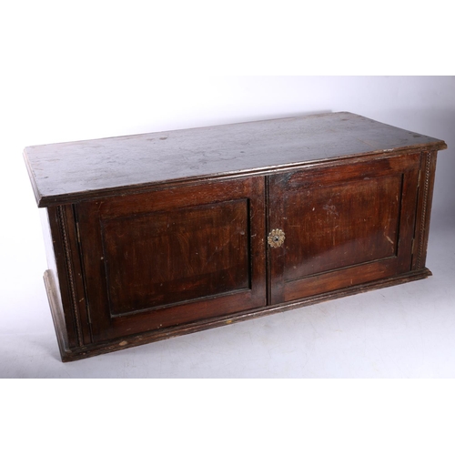 149 - Early 20th century stained pine table box, with two doors to front, 23cm x 60cm x 30cm.