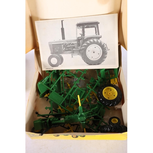 38 - Ertl John Deere 4430 tractor, boxed model kit, and two Airfix Guards' sets, boxed.