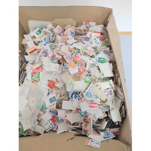 245 - Two boxes containing a large quantity of mixed world postage stamps. (2)