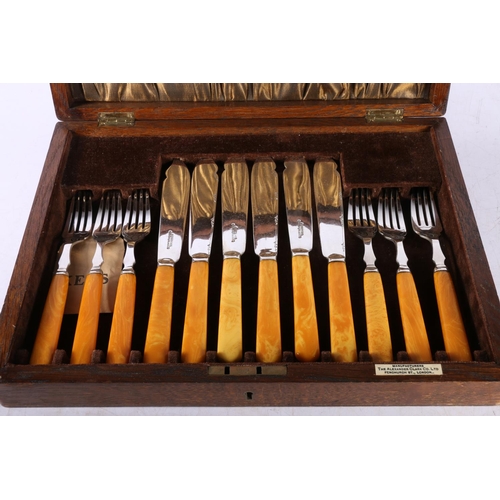 133A - Oak cutlery canteen with set of six fish knives and forks.