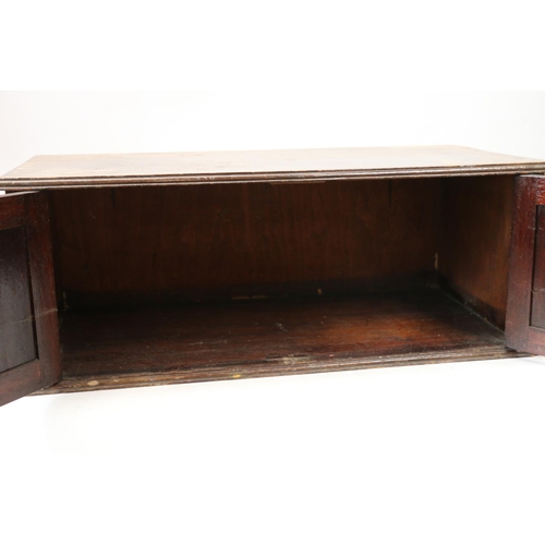 149 - Early 20th century stained pine table box, with two doors to front, 23cm x 60cm x 30cm.