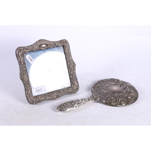 583 - Edward VII silver picture frame, and a white metal hand mirror, 24cm.