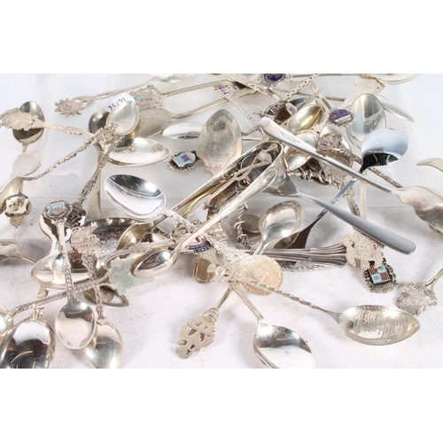 609 - Spoons, some marked silver to include continental, also a white metal bangle with coin charms.