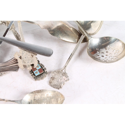 609 - Spoons, some marked silver to include continental, also a white metal bangle with coin charms.