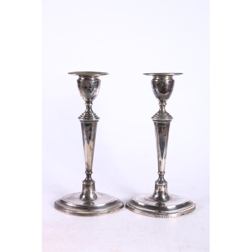 623 - George V pair of silver weighted candlesticks, hallmarked Sheffield 1929, 18cm.