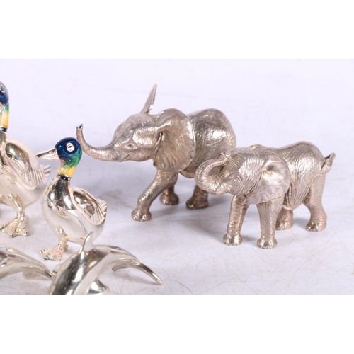 628 - Dolphin table ornament marked Italy 925, 8cm, also white metal ducks, mussel shells, etc.