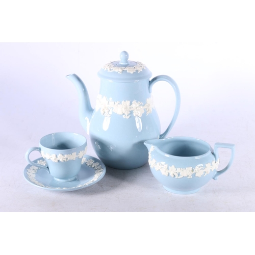 169 - Wedgwood Queensware coffee set, blue ground with embossed cream trailing ivy leaves, comprising a co... 