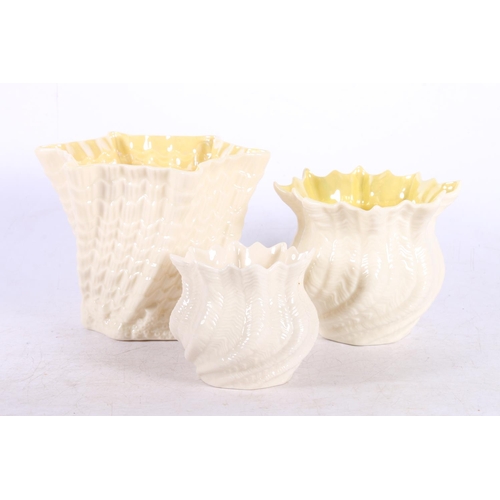 210 - Belleek  vase, 11cm, a similar smaller, and another smaller but unmarked, etc.