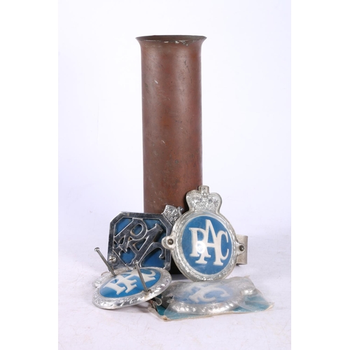 214 - Artillery shell case converted to vase, 25cm, and four RAC car badges.