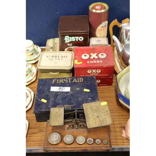 219 - Vintage postal scales inscribed inland postal rates, etc., with weights, and vintage tins.