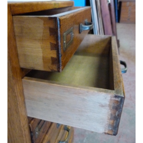 426 - Oak filing cabinet of eight drawers, 104cm high, 47cm wide and 37cm deep.