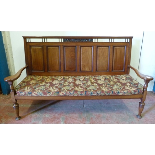 428 - Aesthetic-style mahogany hall bench, the panelled back with fruit and vine carvings, scroll arm rest... 