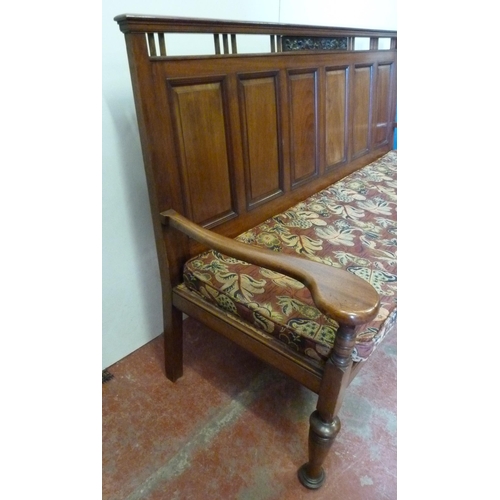 428 - Aesthetic-style mahogany hall bench, the panelled back with fruit and vine carvings, scroll arm rest... 