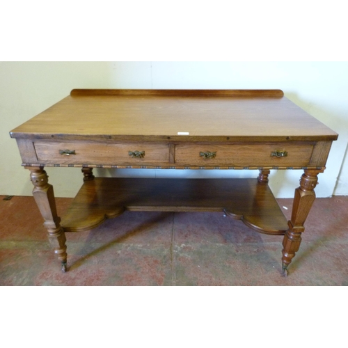 333 - Pugin-style mahogany hall table with faux drawers, on ornate supports united by a shelved undertier,... 