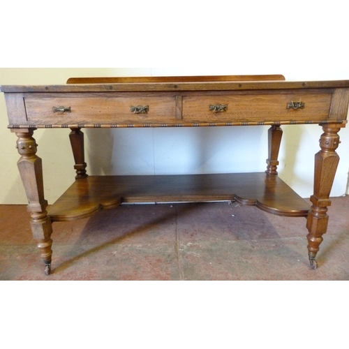 333 - Pugin-style mahogany hall table with faux drawers, on ornate supports united by a shelved undertier,... 