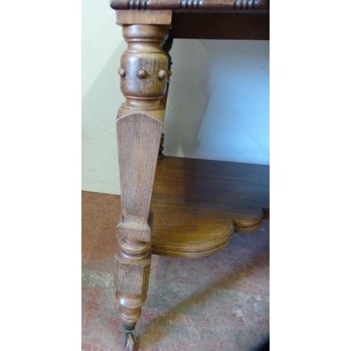 333 - Pugin-style mahogany hall table with faux drawers, on ornate supports united by a shelved undertier,... 