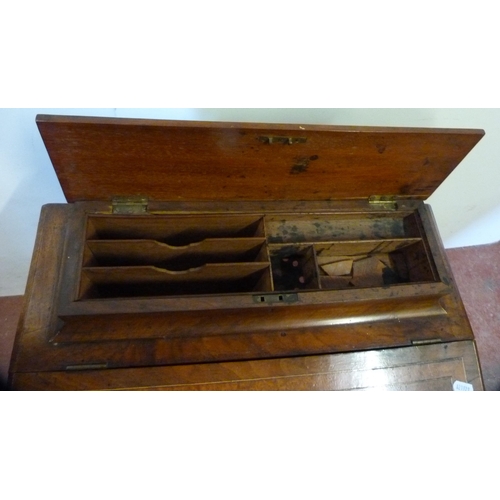 334 - Victorian inlaid walnut davenport with stationery compartment above a tooled writing flap enclosing ... 