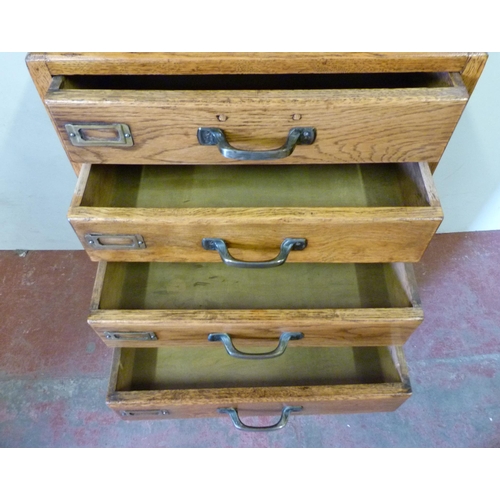 335 - Oak filing cabinet of eight drawers, brass fittings, 104cm high, 46.5cm wide and 37cm deep.