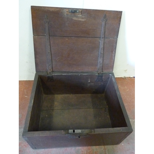 337 - 17th century oak deed box with iron strapwork, escutcheon and handles, 29cm high, 55cm wide and 41.5... 