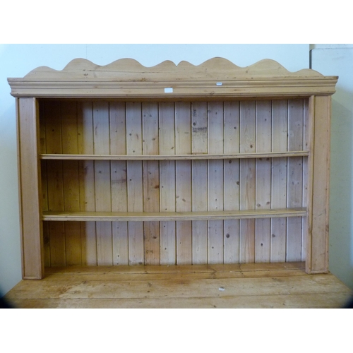 339 - Pine kitchen dresser with shelved Delft rack above a two-door cupboard base enclosing a shelved inte... 