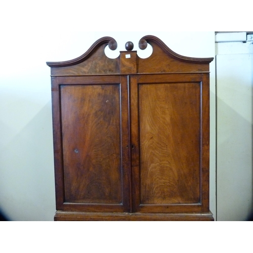 345 - 19th century Gillows-style mahogany linen press, the scroll pediment above two doors, two short and ... 