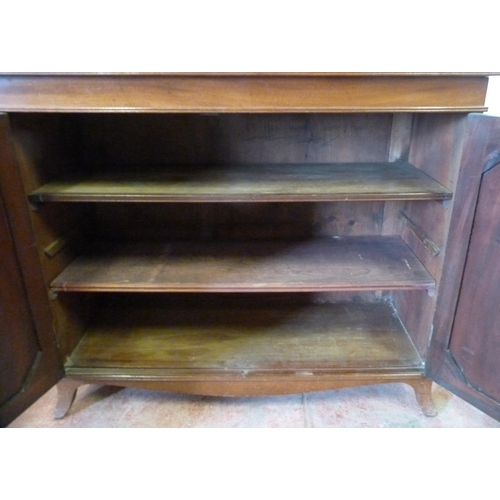 354 - Regency-style 19th century mahogany cupboard of low form, with two cupboard doors enclosing a shelve... 