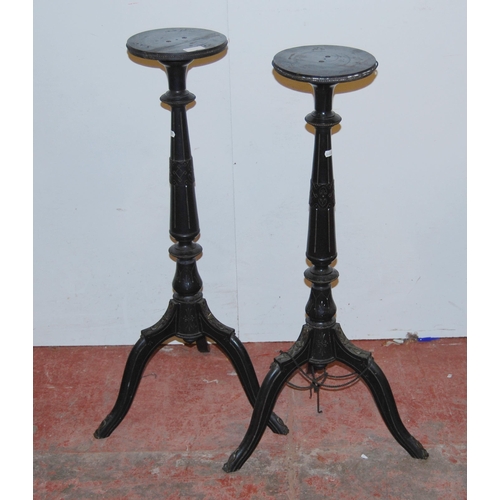 359 - Pair of French Empire-style ebonised torchères, each with a saucer top above a tapered column and tr... 