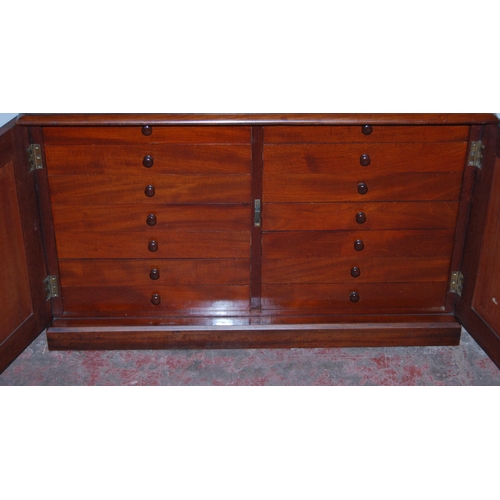 360 - Victorian mahogany specimen chest with two doors enclosing two banks of seven shallow drawers with t... 