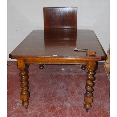 365 - Oak telescopic dining table, c. early 20th century, with one additional leaf, on barley column suppo... 