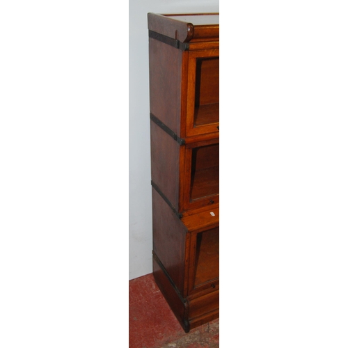 372 - Oak stacking bookcase with three graduated glazed sections, on base, 130cm high, 86.5cm wide and 36c... 