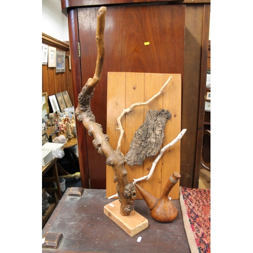 277 - Driftwood sculpture and a driftwood wall plaque, along with water gourd, largest 80cm.