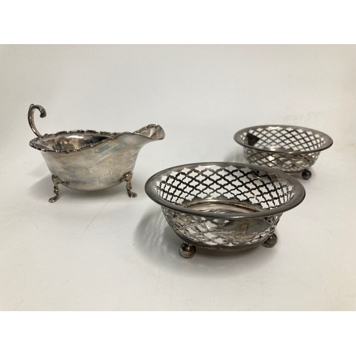 618 - George VI silver sauce boat hallmarked Adie Brothers Ltd, Birmingham 1936, and two pierced footed di... 