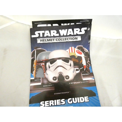 23 - Star Wars monthly magazine 'Helmet Collection' and model helmets.