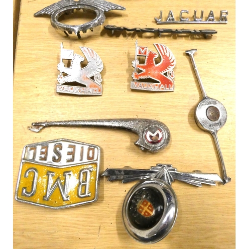 38 - Various vintage car badges to include Jaguar, Morris, Vauxhall, Bedford etc.