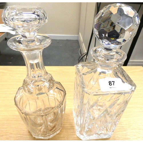 87 - Cut glass square section decanter and stopper and another .