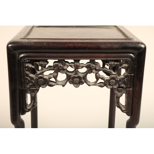 616 - Nest of four Chinese hardwood tables, rectangular painted tops with raised moulded edges above a fri... 