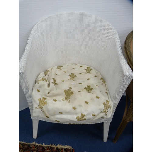 486 - Two woven fibre tub chairs and a modern oval occasional table.  (3)