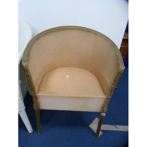 486 - Two woven fibre tub chairs and a modern oval occasional table.  (3)