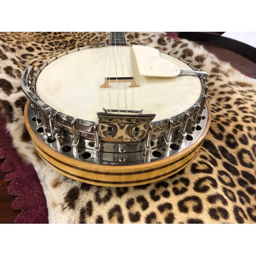 391 - Clifford Essex Paragon four-string Banjo, Paragon decel on head stock, maple back , 19 frets to body