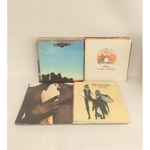 303 - Box of mixed lps to include Fleetwood Mac, Supertramp, Queen, Moody Blues etc.