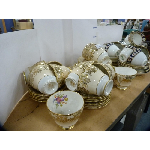 106 - Paragon part tea set and a Diamond part tea set decorated in the Imari palette. 