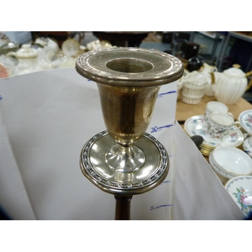 111 - Antique mahogany candlestick with a silver sconce.